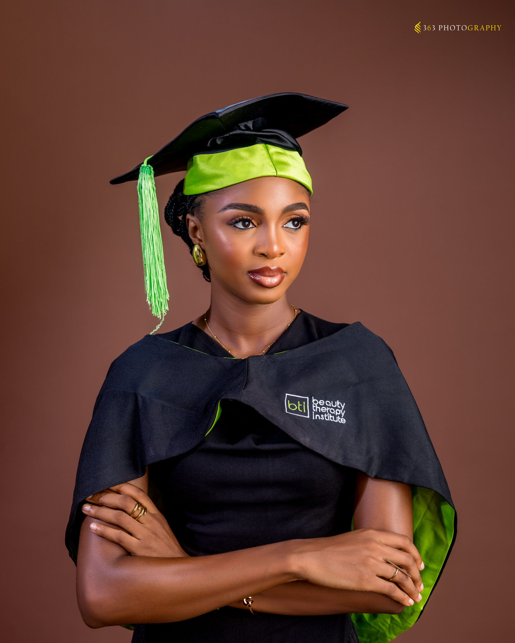 Ifedami at her international Aesthetician graduation, celebrating becoming a certified skincare professional.